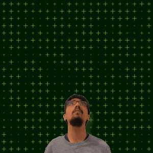 A Man Stands In Front Of A Green Background With The Number 12 + 2 GIF