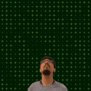 A Man Stands In Front Of A Green Background With The Number 19 + 15 On It GIF