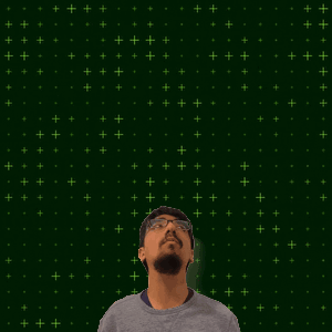 A Man Stands In Front Of A Green Background With The Number 25 In The Center GIF