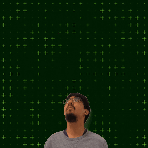 A Man Stands In Front Of A Green Background With The Number 9 + 14 GIF
