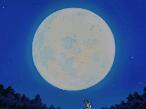 A Man Stands In Front Of A Large Full Moon GIF