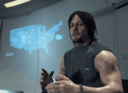 A Man Stands In Front Of A Map Of The United States Of America GIF