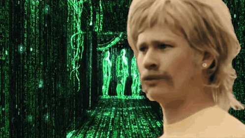 A Man Stands In Front Of A Matrix Screen GIF