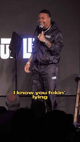 A Man Stands In Front Of A Microphone And Says " I Know You Fckin Lying " GIF