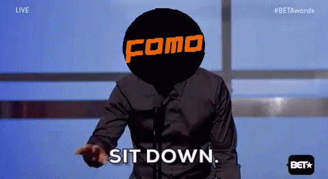 A Man Stands In Front Of A Microphone With A Como Logo On His Head GIF