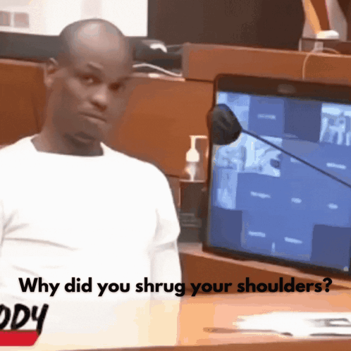 A Man Stands In Front Of A Microphone With The Words " Why Did You Shrug Your Shoulders " On The Bottom GIF