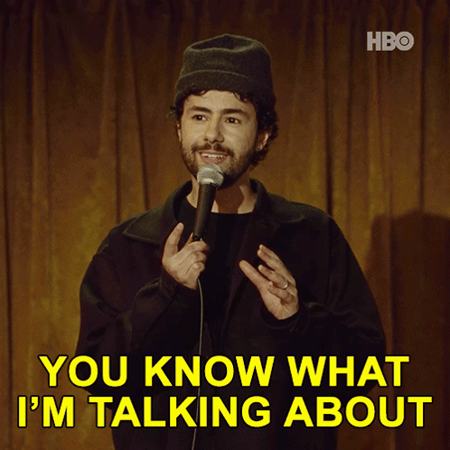 A Man Stands In Front Of A Microphone With The Words You Know What I 'M Talking About Above Him GIF