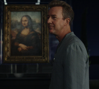 A Man Stands In Front Of A Painting Of A Woman GIF