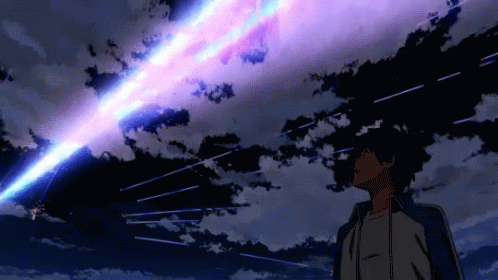 A Man Stands In Front Of A Purple And Blue Sky With Stars GIF