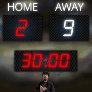 A Man Stands In Front Of A Scoreboard That Reads Home 29 Away GIF