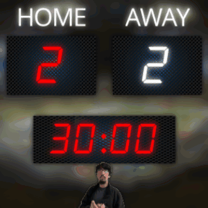 A Man Stands In Front Of A Scoreboard That Says Home 2 And Away 2 GIF