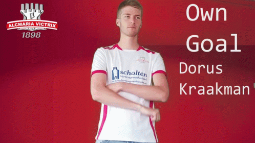 A Man Stands In Front Of A Sign That Says Almaria Victrix 1898 GIF