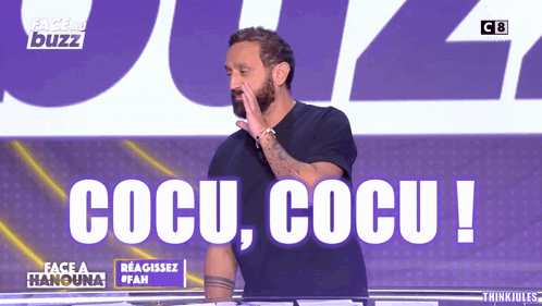 A Man Stands In Front Of A Sign That Says Cocu GIF