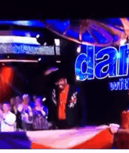 A Man Stands In Front Of A Sign That Says ' Dallas ' On It GIF