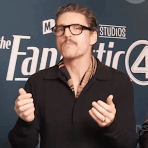 A Man Stands In Front Of A Sign That Says The Fantastic 4 GIF