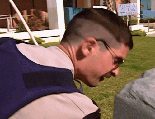 A Man Stands In Front Of A Sign That Says Yuma Calling GIF