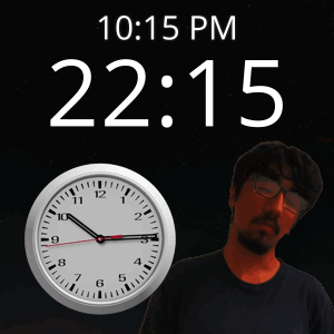 A Man Stands In Front Of A Wall Clock That Says 10:15 Pm GIF