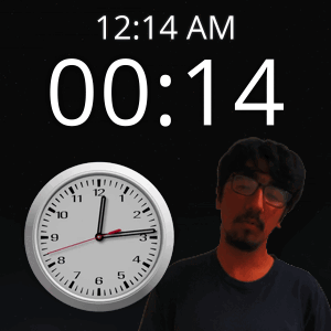 A Man Stands In Front Of A Wall Clock That Says 12:14 Am GIF
