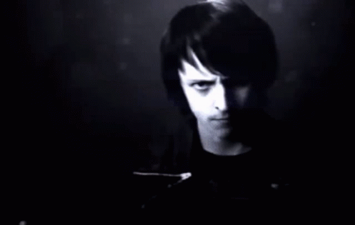 A Man Stands In Front Of A Wall Of Numbers GIF
