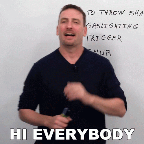 A Man Stands In Front Of A White Board That Says Hi Everybody On It GIF