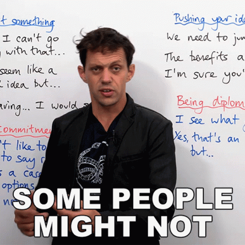 a man stands in front of a white board that says " some people might not " on it