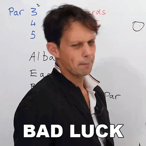 A Man Stands In Front Of A White Board With The Words " Bad Luck " On It GIF
