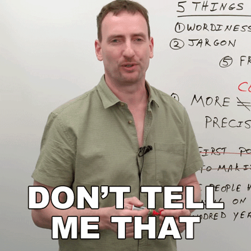 A Man Stands In Front Of A White Board With The Words " Do N't Tell Me That " GIF