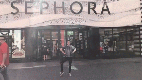 A Man Stands In Front Of The Sephora Store GIF