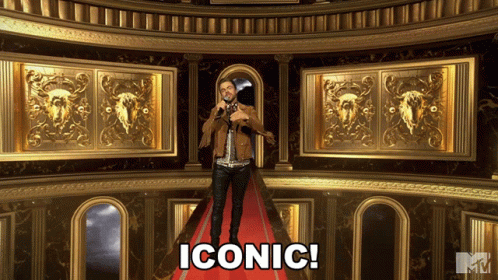 A Man Stands On A Red Carpet With The Word Iconic Written On The Bottom GIF