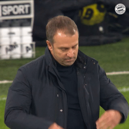 A Man Stands On A Soccer Field With A Sign That Says Sport On It GIF