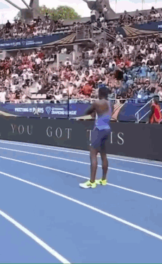 A Man Stands On A Track In Front Of A Sign That Says ' You Got This ' GIF