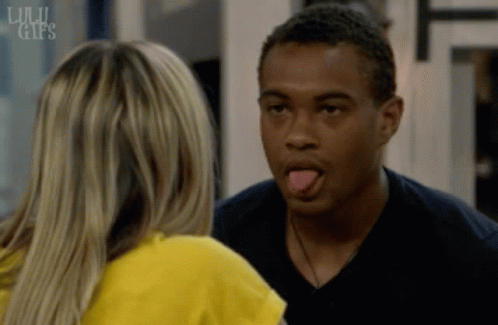 A Man Sticking His Tongue Out While Looking At A Woman With The Words Lulu Gifs On The Bottom Right GIF