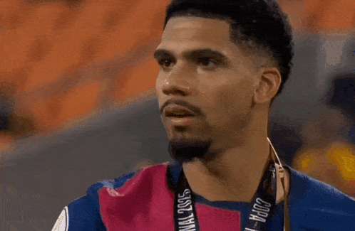A Man Sticking His Tongue Out While Wearing A Shirt With A Lion On It GIF