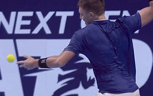 A Man Swings A Tennis Racket In Front Of A Next Atp Finals Sign GIF