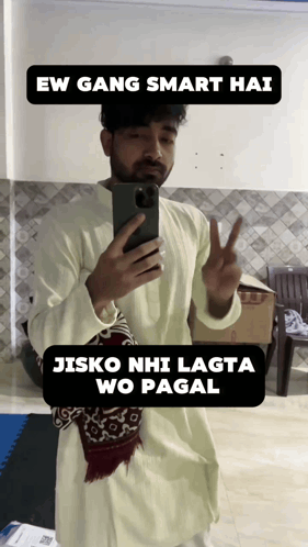 A Man Taking A Picture Of Himself With A Caption That Says " Ew Gang Smart Hai Jisko Nhi Lagta Wo Pagal " GIF