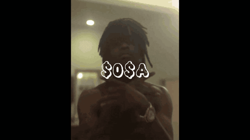 a man taking a picture of himself with the word sosa written on it