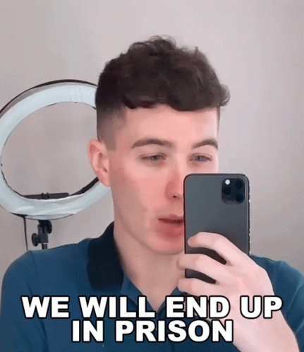 a man taking a picture of himself with the words we will end up in prison below him