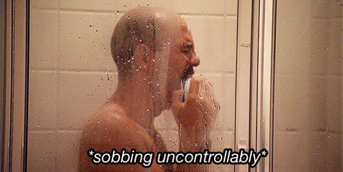 A Man Taking A Shower With The Words " Sobbing Uncontrollably " On The Bottom GIF