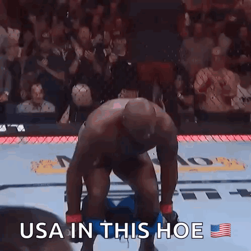 A Man Taking Off His Pants In A Boxing Ring With The Caption Usa In This Hoe GIF