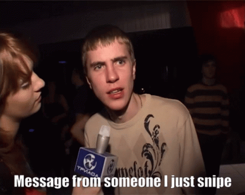 A Man Talking Into A Microphone That Says " Message From Someone I Just Snipe " On It GIF