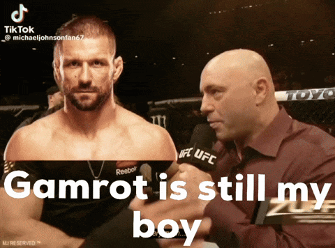 A Man Talking Into A Microphone With The Words Gamrot Is Still My Boy Below Him GIF
