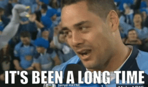 A Man Talking Into A Microphone With The Words " It 'S Been A Long Time " Below Him GIF