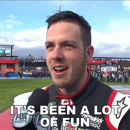 A Man Talking Into A Microphone With The Words It 'S Been A Lot Of Fun Above Him GIF