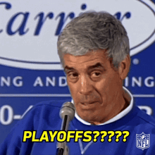 A Man Talking Into A Microphone With The Words Playoffs On The Bottom GIF
