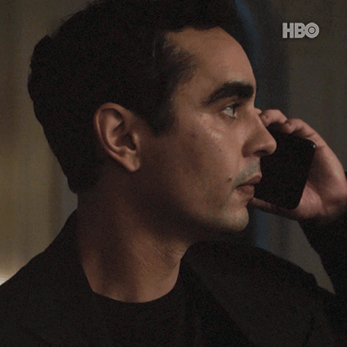 A Man Talking On A Cell Phone With The Words " Do N't Do Anything " GIF