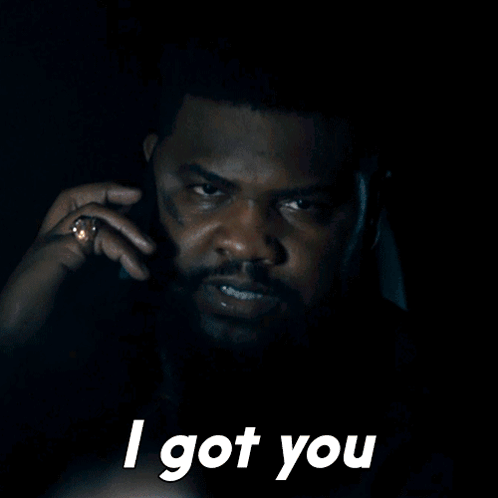 A Man Talking On A Cell Phone With The Words " I Got You " Above Him GIF