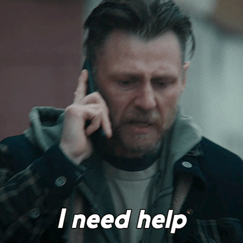 A Man Talking On A Cell Phone With The Words I Need Help Above Him GIF