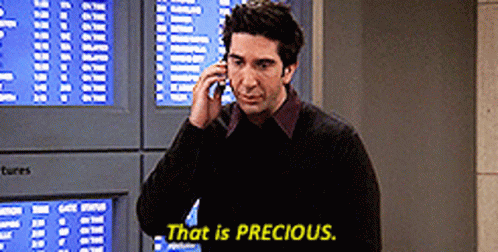 A Man Talking On A Cell Phone With The Words That Is Precious Written Below Him GIF