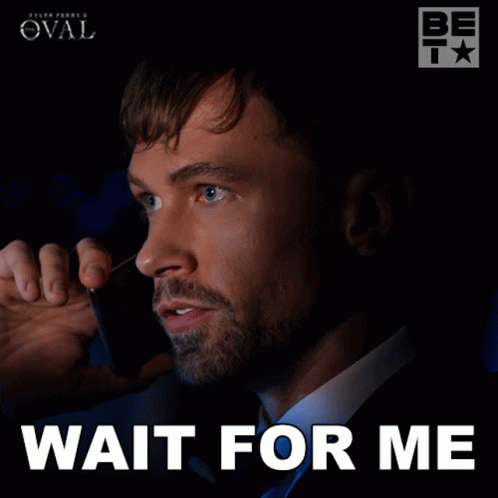 A Man Talking On A Cell Phone With The Words Wait For Me Written Below Him GIF
