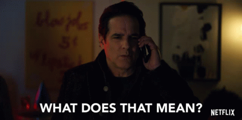 A Man Talking On A Cell Phone With The Words " What Does That Mean " Written On The Bottom GIF
